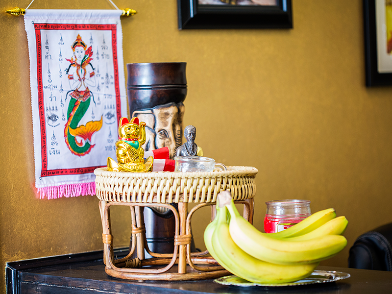 poster, basket and bananas on front counter